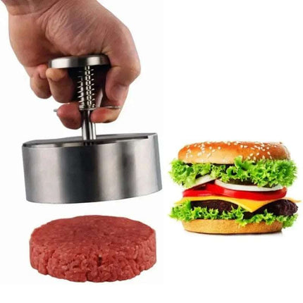 A hand holding a metal burger press over raw meat, next to a burger.